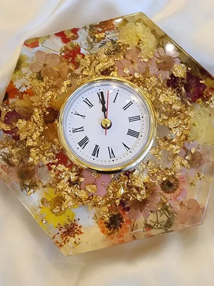 A different angle of this 8 inch desk clock, showing the depth and detail of the preserved flowers and gold flakes.