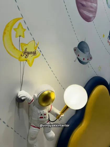 Another detail from the astronaut-themed room, showing the personalized "Ayansh" name art held by the astronaut lamp. I love adding these custom touches that make a child's room feel truly their own.