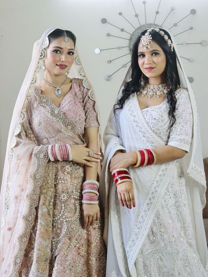 Two brides, two beautiful looks. I can create coordinated looks for sisters or friends getting married together.