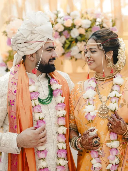 A beautiful portrait of a Maharashtrian couple after their ceremony, looking at each other with love and happiness.