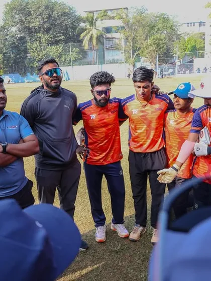A team huddle during a break in our preparation match against Sanjeevani Cricket Academy. Team spirit and strategy are key.