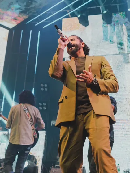 A full-length shot of Farhan Akhtar during his energetic performance. We don't just book artists; we produce entire shows.
