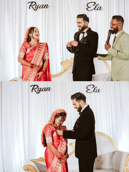 A beautiful moment of tradition during the reception, where the groom honors the bride with a symbolic gesture, all happening on a beautifully decorated stage under my hosting.