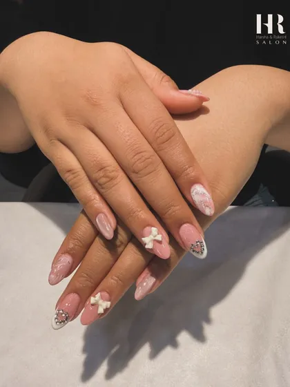 The complete look of these adorable bow and heart nails. The almond shape and soft colour palette make them elegant, while the 3D details add a fun and playful touch.