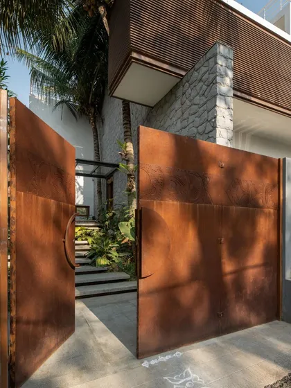 The entrance to a home sets the first impression. For the Siri residence, I designed these large, bespoke gates from corten steel. The material has a beautiful, evolving patina that complements the natural stone and lush greenery of the entrance pathway.
