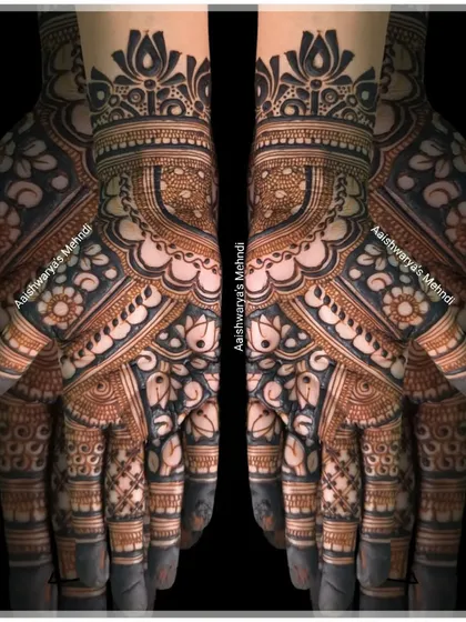 A bold and beautiful back-hand design featuring large lotus motifs and intricate finger details. This style makes a statement.