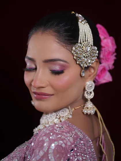 The eye makeup detail is visible here, with a soft blend of pink and shimmer that makes her eyes pop.