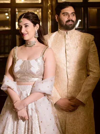 Shalmali looked like she stepped out of a Bollywood fairytale for her Sangeet. This white and gold lehenga was her second outfit of the evening, and her makeup was designed to transition seamlessly.