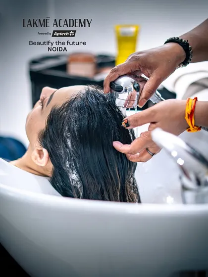 A close-up of the hair wash, an essential step in any chemical treatment. We teach the correct techniques for product application and removal.