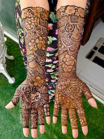 A full view of a gorgeous bridal floral design I did for the mother of the groom. It shows that beautiful, intricate mehendi is for everyone in the family.