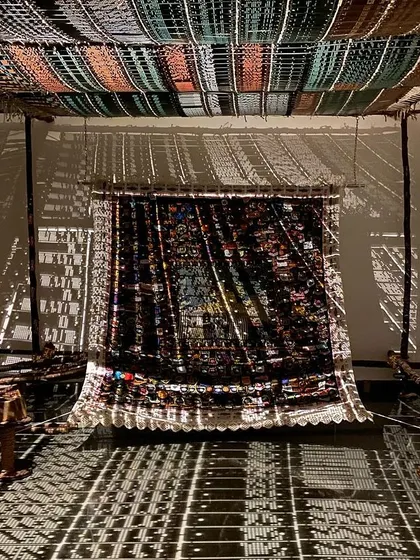 An immersive installation from Archana Hande's 'WEAVING LIGHT'. I believe in transforming spaces. Here, we used light and shadow projected through traditional jacquard loom punch cards to create a magical, shifting landscape that tells a story of craft and technology.
