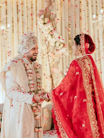 The laughter and love shared between the bride and groom during their Varmala ceremony. These are the candid, joyful moments that make a wedding story truly personal.