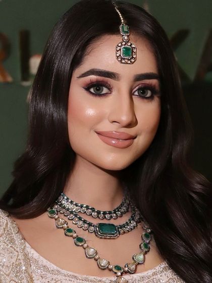 A close-up of Aastha's engagement makeup. You can see the blend of the pink and brown tones on the eye, creating a soft yet defined look.