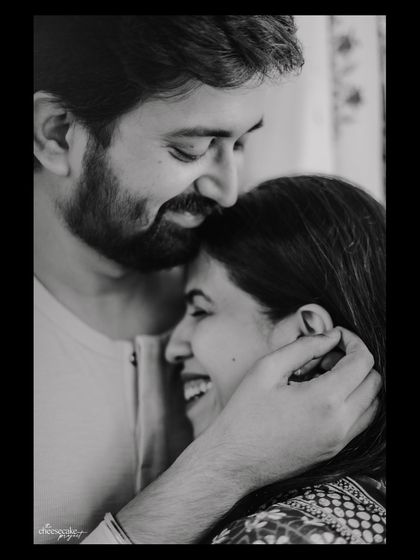 A sweet forehead kiss and a genuine laugh. Capturing real affection is my goal.