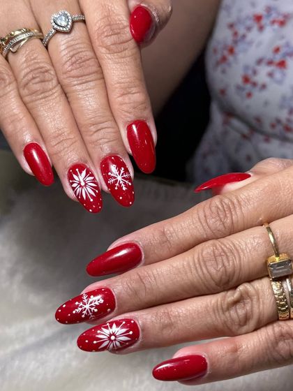 Another view of these beautiful red and white snowflake Christmas nails. This is a timeless holiday design that looks great on any nail shape.
