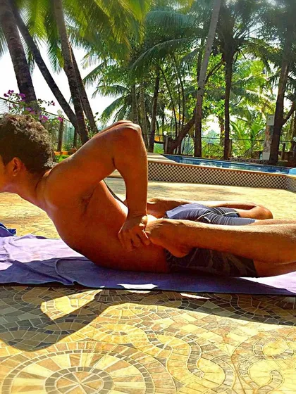 An old photo of me in Bhekasana, or Frog Pose. This is a powerful posture for opening the front of the body and preparing for deeper backbends.