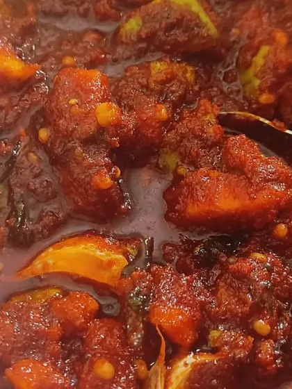 A close-up of my instant mango pickle, or 'chinnamukkala mamidikaya pachadi'. It’s the perfect combination of sour, spicy, and salty, and tastes amazing with hot rice, mudda pappu, and a little bit of ghee.