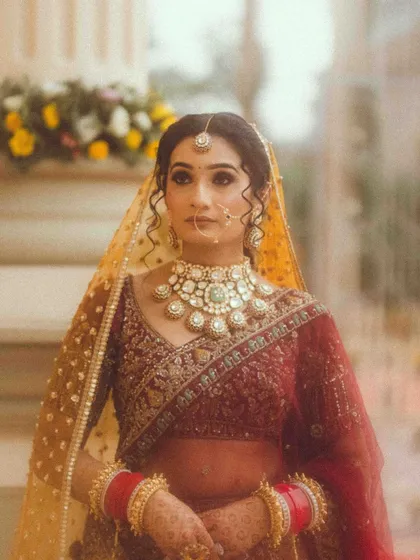 A classic bridal portrait. The soft, natural light and her serene expression create a timeless and elegant image, showcasing her traditional attire.