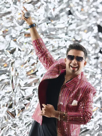 Dressed for a banger of a night. The outfit, the stage, the energy, it all comes together to create a show. This look, with the shimmering jacket against a sparkling backdrop, captures the vibrant and celebratory mood I bring to every performance.
