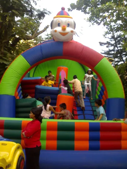 This Obstacle Slide Bouncy features a climbing ladder and various pop-up obstacles inside. It combines the fun of a traditional bouncy castle with a small challenge course.