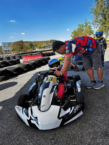 Our coach providing last-minute instructions to a young driver at the Rotax International Trophy in Asia.