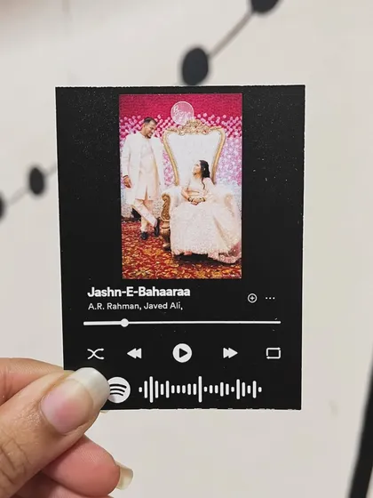 A close-up of a custom Spotify card featuring the song "Jashn-E-Bahaaraa" and a beautiful wedding photo. It's a memory and a song all in one.