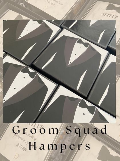 A top down view of our 'Groom Squad Hampers', showcasing the clever tuxedo design on the box lids.