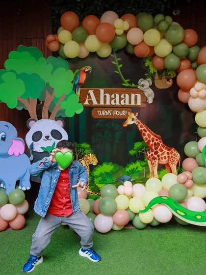 The birthday boy strikes a pose, ready for his wild adventure. Our jungle theme is perfect for energetic kids who love to explore.