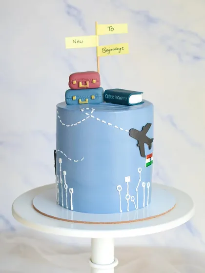 A farewell cake for someone starting a new beginning abroad. This travel-themed cake features a world map, an airplane, and luggage, representing the exciting journey ahead.