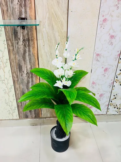 A similar artificial plant with bright white flowers, offering a classic and clean look for any setting.