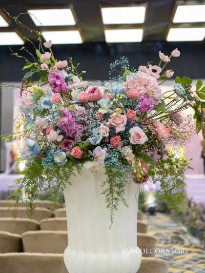 A magnificent floral urn arrangement featuring a symphony of pastel colors. I used shades of lavender, pink, and baby blue to create a lush and romantic piece that feels like a classic painting.