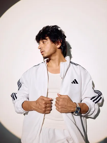 A profile shot from the spotlight series. The lighting and pose create a dynamic and stylish look.