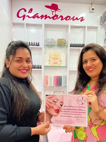 Celebrating another student's graduation. She has successfully completed the professional course and is now a certified nail artist.