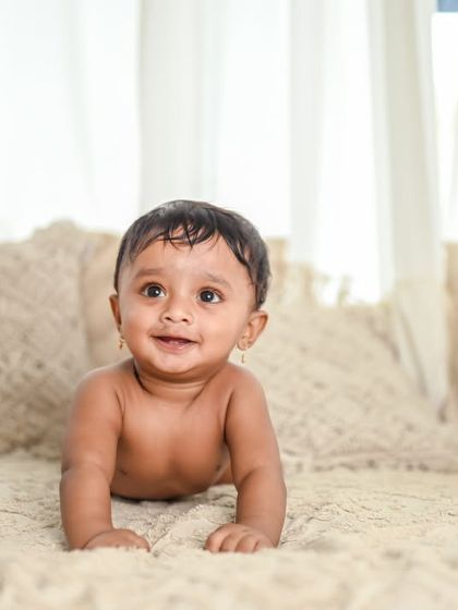 A simple and natural shot of a baby crawling. Milestone sessions are perfect for capturing these big achievements.