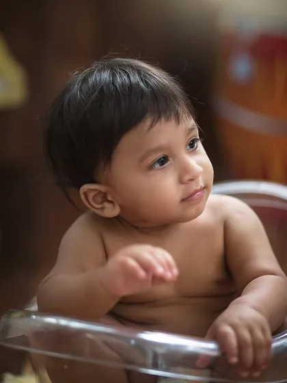 A soft, thoughtful profile. Without the distraction of props, we can capture the quiet, gentle moments that reveal your child's personality.