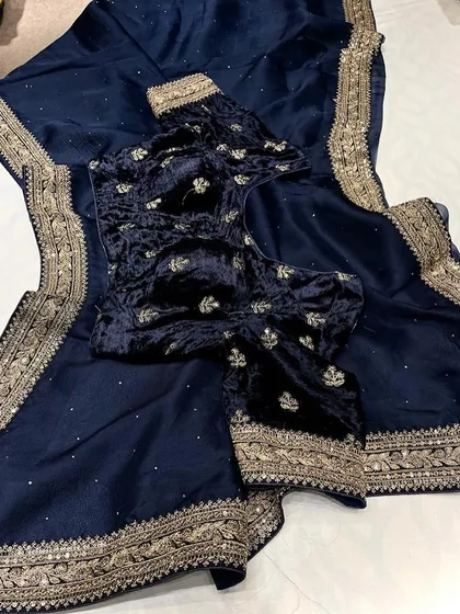 A look at my Sabyasachi-inspired collection. These sets feature pure organza sarees with detailed borders, paired with luxurious velvet designer blouses. They are available in a range of beautiful colors like brown, navy, green, black, yellow, purple, and off-white.
