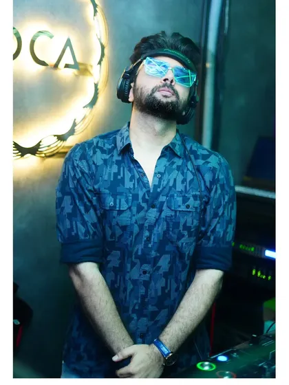 A moment to understand, realize, and absorb the moment. A thoughtful pose at Toca, taking it all in before the party starts.