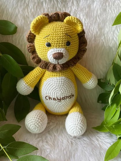 A personalized lion plushie with the name "Chayansh" embroidered on his belly. This sunny yellow lion is ready to be a brave and loyal friend.