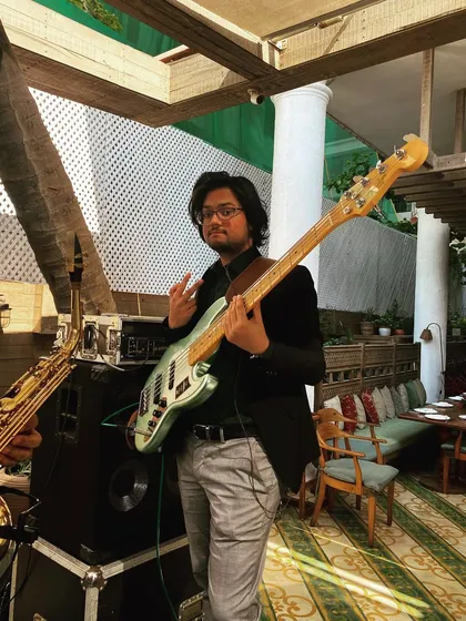 Our bassist Mikhail, ready to go for a pre-gig soundcheck. We make sure every instrument sounds perfect before the show begins.