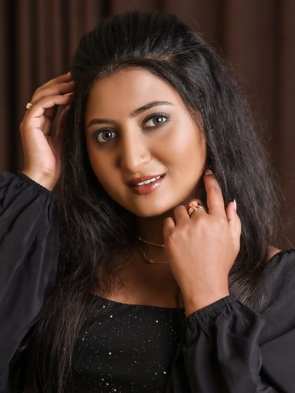 Studio and outdoor portraits of a model in a simple yet elegant black dress. This series focuses on capturing genuine expressions and personality, from joyful laughter to quiet contemplation.