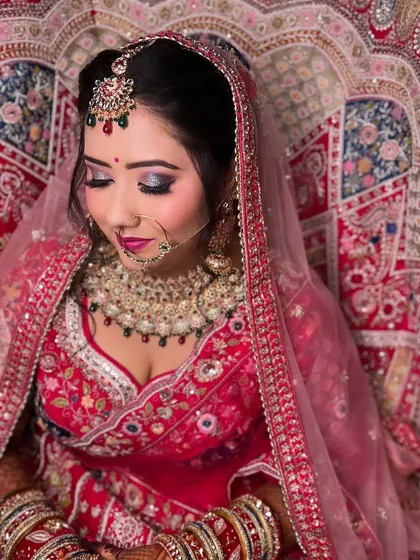 A cute and gorgeous bride. The makeup is soft and pretty, with a focus on pink tones and a flawless base.