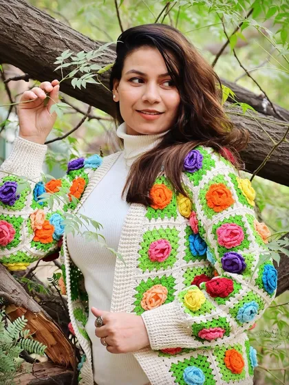 Our granny square jacket, adorned with colorful 3D flowers, is a celebration of vibrant, wearable art. It’s a modern take on a classic crochet technique, perfect for those who love to wear their personality.
