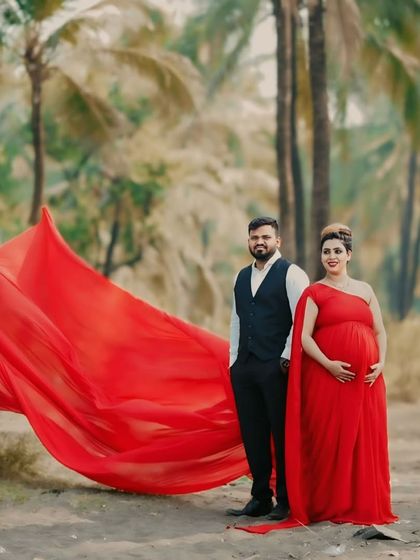 A classic choice for a reason. This red georgette infinity gown with a long trail is one of our most popular rentals for both maternity and pre-wedding shoots.
