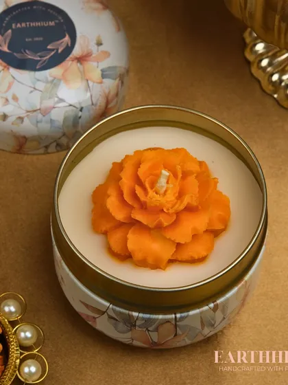 This marigold-inspired candle in a tin jar is perfect for festive occasions, bringing a traditional flower into a modern form.