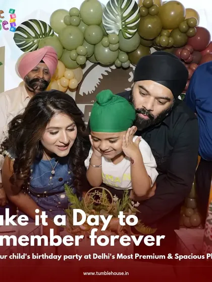 A touching moment as a family helps their son with his birthday cake at his dinosaur-themed party. Making it a day to remember forever.