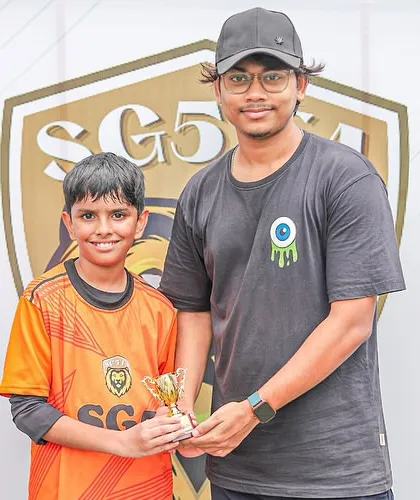 A player is recognized for his on-field excellence, a moment of pride for him and his team.