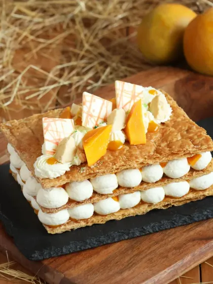 A summery twist on a classic pastry, our Mango Mille-feuille features layers of flaky pastry, cream, and fresh mango.