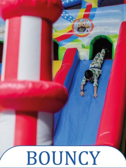 A classic bouncy castle with a slide is always a crowd-pleaser. This colorful inflatable provides hours of jumping and sliding fun for children.