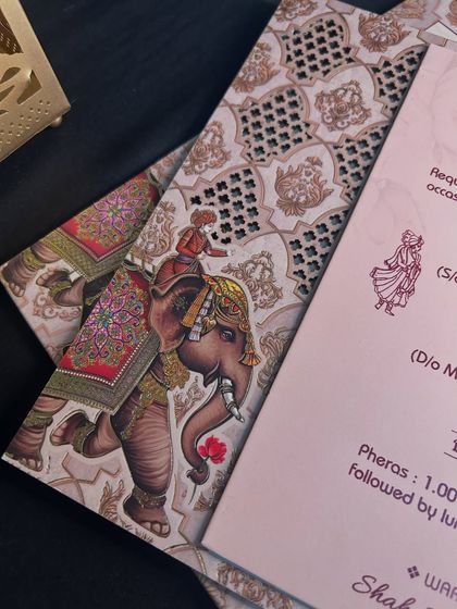 The majestic elephant illustration appears to walk right off the laser-cut panel, creating a dynamic and layered composition.