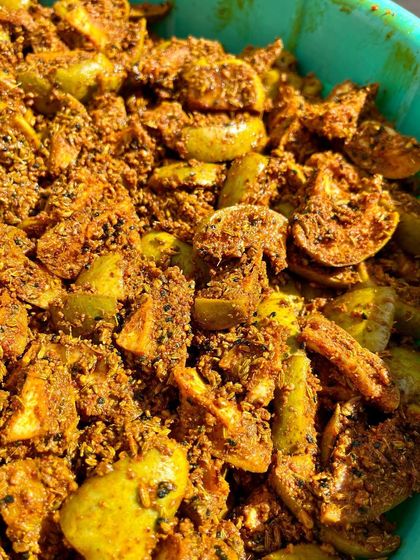 Let's take a moment to appreciate this beauty. This is our bestseller, Punjabi Aam ka Achaar, in the making. The raw mangoes are mixed with spices and left to soak in all the flavours.